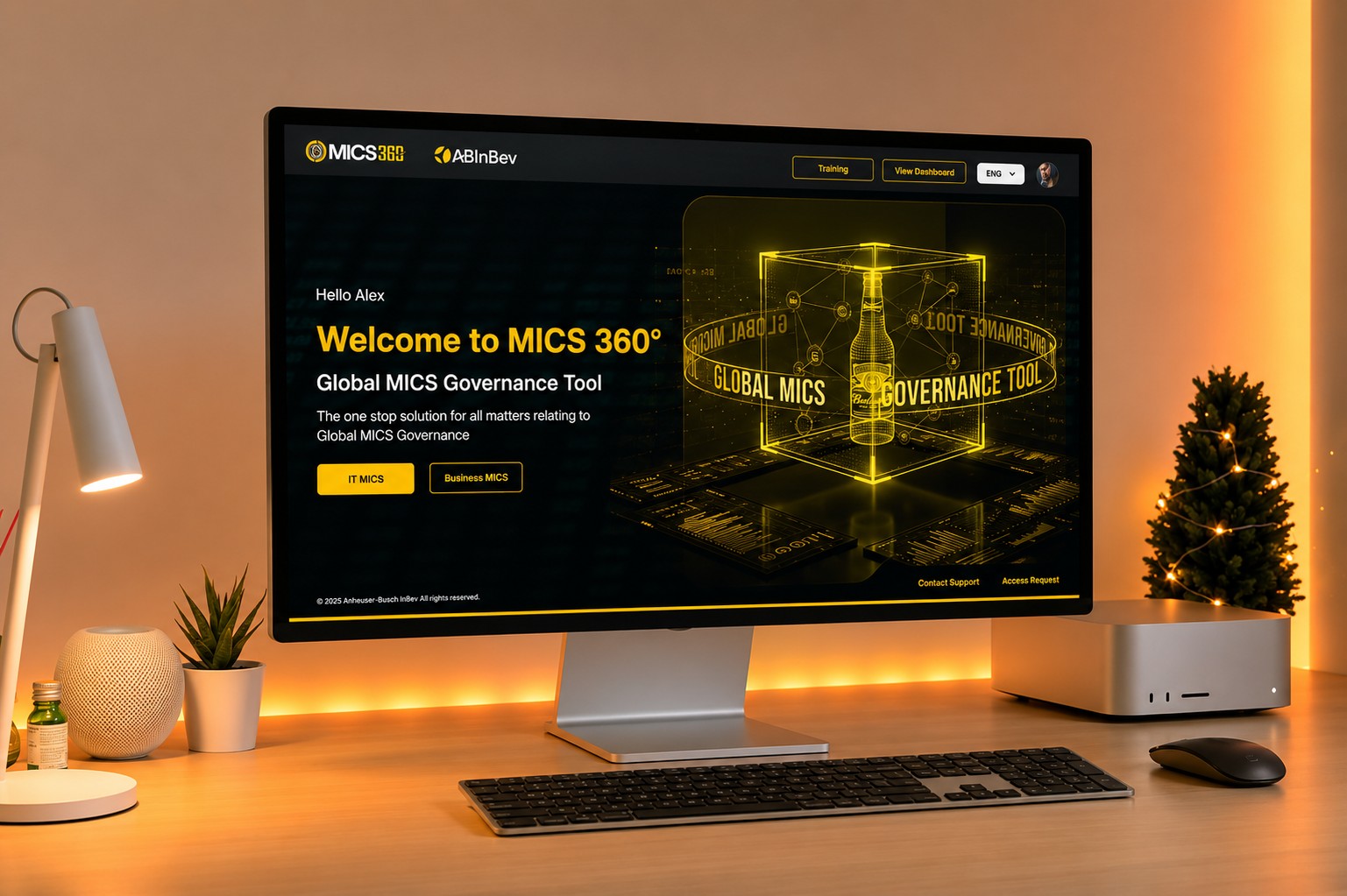 The MICS 360 landing screen on a desktop monitor, a dark interface with the AB InBev brand and a welcome message for a signed in user.